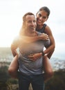 Portrait, piggy back and couple with love, outdoor and lens flare with happiness, freedom and bonding. Face, man