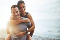 Portrait, piggy back and couple with vacation, outdoor and lens flare with happiness, holiday and bonding. Face, man