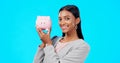 Portrait, piggy bank or happy Indian woman with savings budget or financial profits growth on studio background. Smile Royalty Free Stock Photo