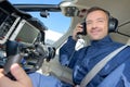Portrait pilot in aircraft