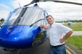 portrait pilot standing in front helicopter Royalty Free Stock Photo