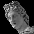 Portrait of a plaster statue of Apollo isolated on black