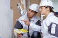 Portrait plasterers team performing wall renovation Royalty Free Stock Photo