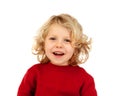 Portrait of playful small kid with long blond hair looking at ca