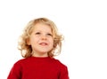 Portrait of playful small kid with long blond hair looking up