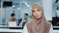 Portrait of pleasant serious arabian businesswoman in hijab confident female insurance broker bank manager hr assistant