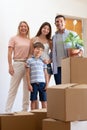 Portrait of pleased family in new house