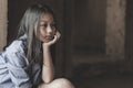 Portrait of a poor little thailand girl lost in deep thoughts, poverty, Poor children Royalty Free Stock Photo