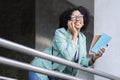 Portrait of positive african woman have phone conversation at office Royalty Free Stock Photo