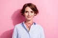 Portrait of positive cheerful adorable nice girl with bob hairstyle wear blue stylish blouse smiling isolated on pink Royalty Free Stock Photo