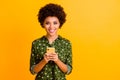 Portrait of positive cheerful afro american girl social network addicted user hold smartphone read social media news