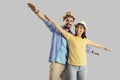 Portrait positive cheerful couple tourist posing with arms like airplane wings