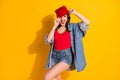 Portrait of positive cheerful crazy funny youth teenager girl touch her street style headwear enjoy rejoice scream wear Royalty Free Stock Photo