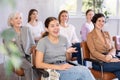 Portrait of positive cheerful female students at a lecture at university