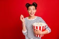 Portrait of positive cheerful funky girl watch television find favorite tv show scream wow omg hold big popcorn box wear Royalty Free Stock Photo