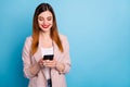 Portrait of positive cheerful girl ceo manager use smartphone read social network news repost subscribe share post wear