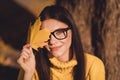 Portrait of positive cheerful girl enjoy fall park forest rest relax tree background close cover eye face maple colorful