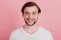 Portrait of positive cheerful handsome guy toothy beaming smile on pink background Royalty Free Stock Photo