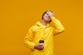 Portrait of positive cool man in warm autumn top outdoor clothes holding coffee Royalty Free Stock Photo