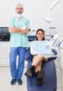 Portrait of positive dentist and happy cute woman