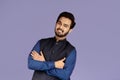 Portrait of positive Indian guy with crossed arms on violet background