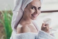 Portrait of positive joyful lady in home interior spa salon resort wait for cosmetologist drink aromatic espresso Royalty Free Stock Photo