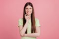 Portrait of positive minded girl happy smile touch chin finger think thoughts isolated over pastel color background