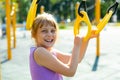 Portrait of a positive nine year old teenage girl on a playground