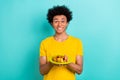 Portrait of positive person toothy smile arms hold fried potato sausage plate isolated on teal color background