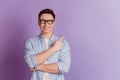 Portrait of positive promoter guy indicate finger empty space on violet background Royalty Free Stock Photo