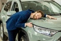 Funny caucasian man buyer in dealership Royalty Free Stock Photo