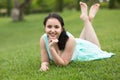 Portrait of smiling young girl while lying in outdoors Royalty Free Stock Photo