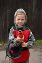 Portrait of positive tween girl paintball player with marker gun ready for game outdoors Royalty Free Stock Photo