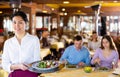 Portrait of positive waitress in restaurant Royalty Free Stock Photo