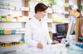 Pharmacist ready to assist in choosing at counter