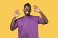 Portrait Of Positive Young Black Man Showing Ok Gesture, Studio