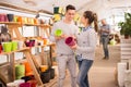 Portrait of positive young couple at the garden store Royalty Free Stock Photo