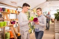 Portrait of positive young couple at the garden store Royalty Free Stock Photo