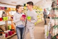 Portrait of positive young couple at the garden store Royalty Free Stock Photo