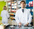 Portrait of male pharmacists working in modern farmacy Royalty Free Stock Photo