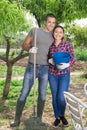 Positive young married couple in the garden Royalty Free Stock Photo