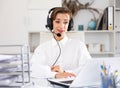 Portrait of positive young woman call center worker Royalty Free Stock Photo