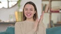 Portrait of Positive Young Woman Clapping at Home