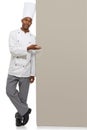 Portrait, poster and black man chef with hand pointing in studio for checklist, menu or space on white background