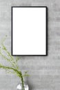 Portrait Poster Frame Mockup on the concrete cement wall minimalism style