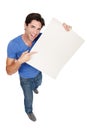 Portrait, poster or happy man with a board for marketing, promotion or advertising deal in studio. Above, offer or male