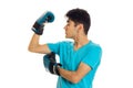 Portrait of powerful brunette sports man practicing box in blue gloves isolated on white background Royalty Free Stock Photo