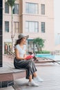 Portrait of pPretty cheerful woman relax and reading book in vacation on summer season at resort swimming pool