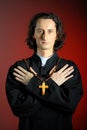 portrait of Praying priest with wooden cross