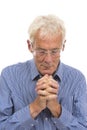 Portrait praying senior man